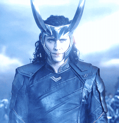 A Man Wearing A Helmet With Horns On His Head Looks At The Camera GIF