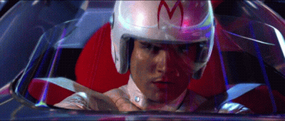 A Man Wearing A Helmet With The Letter M On It Is Sitting In A Car GIF