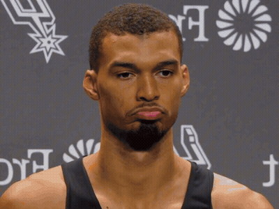 A Man Wearing A Hilton For The Stay Branded Shirt GIF