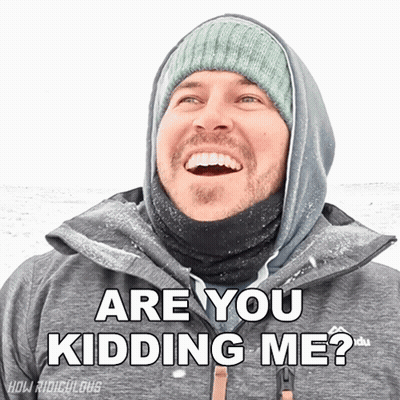 A Man Wearing A Hooded Jacket And A Beanie Smiles And Says " Are You Kidding Me " GIF