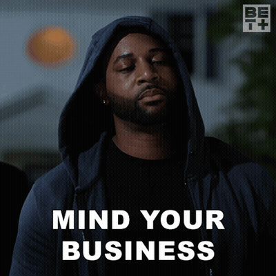 A Man Wearing A Hooded Jacket Says " Mind Your Business " GIF