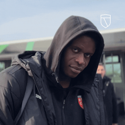 A Man Wearing A Hooded Jacket With A Rc Logo On It GIF