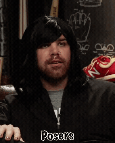 A Man Wearing A Hooded Jacket With The Word Posers On The Bottom GIF