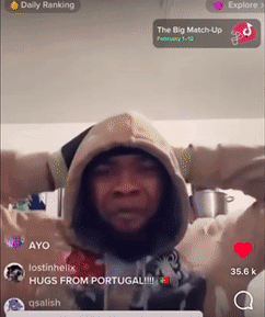 A Man Wearing A Hooded Sweatshirt With His Arms Outstretched In Front Of A Screen That Says Daily Ranking On It GIF