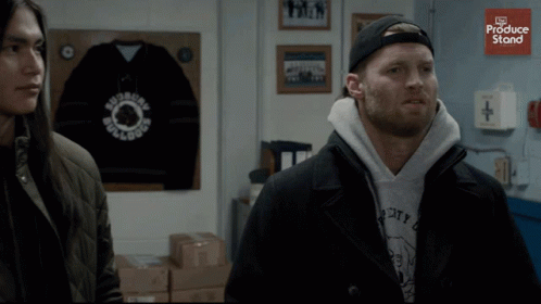 A Man Wearing A Hoodie That Says City Is Standing Next To A Woman GIF