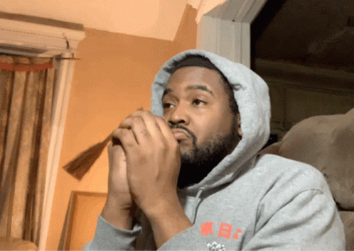 A Man Wearing A Hoodie That Says Kb On The Sleeve GIF