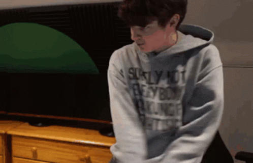 A Man Wearing A Hoodie That Says ' Scarly Not Everybody ' GIF