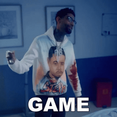A Man Wearing A Hoodie With A Picture Of A Man And The Word Game GIF