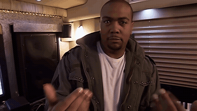 A Man Wearing A Jacket And A White Shirt Is Talking GIF