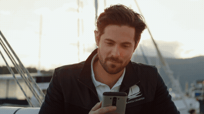 A Man Wearing A Jacket That Says Angel Chartered On It GIF