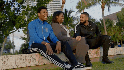 A Man Wearing A Jacket That Says ' Miami ' On It GIF
