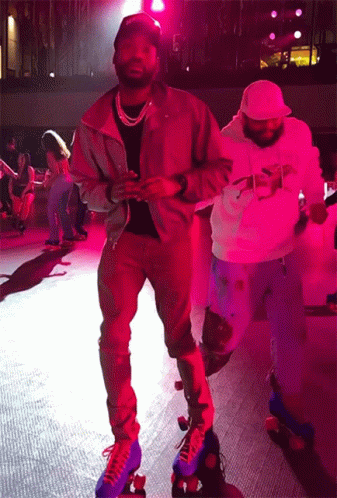 A Man Wearing A Jacket That Says Supreme Is Rollerblading On A Rink GIF