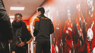 A Man Wearing A Jacket With Hull City On The Back GIF