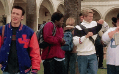 A Man Wearing A Jacket With The Letter L On The Front GIF