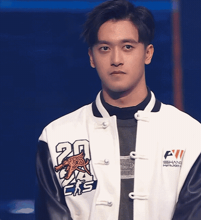 A Man Wearing A Jacket With The Number 20 On The Sleeve GIF