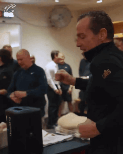 A Man Wearing A Jacket With The Word Cowboys On The Sleeve GIF