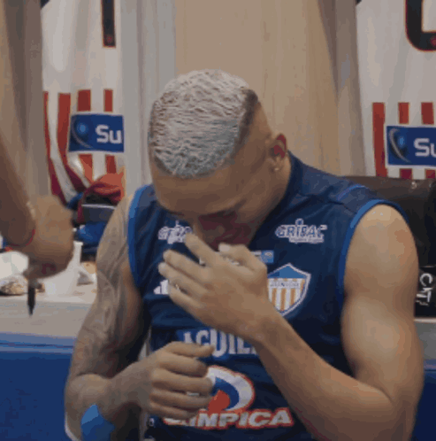 A Man Wearing A Jersey That Says " Aguila " On It GIF