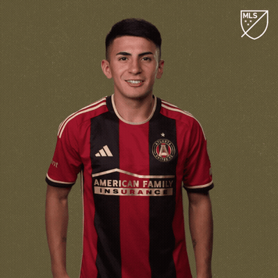 A Man Wearing A Jersey That Says " American Family Insurance " GIF