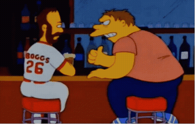 A Man Wearing A Jersey That Says Boggs 26 Is Sitting At A Bar GIF