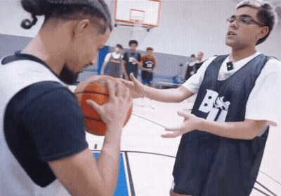A Man Wearing A Jersey With The Letter B On It Is Holding A Basketball GIF