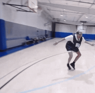 A Man Wearing A Jersey With The Letter B On It Is Playing Basketball GIF