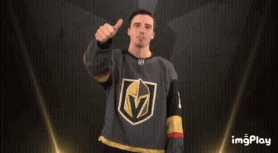 A Man Wearing A Jersey With The Letter M On It Gives A Thumbs Up GIF