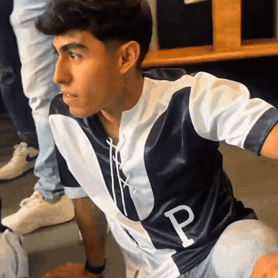 A Man Wearing A Jersey With The Letter P On The Front GIF