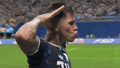 A Man Wearing A Jersey With The Number 21 On It Salutes On A Soccer Field GIF
