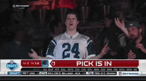 A Man Wearing A Jersey With The Number 24 On It Stands In Front Of A Screen That Says Pick Is In GIF