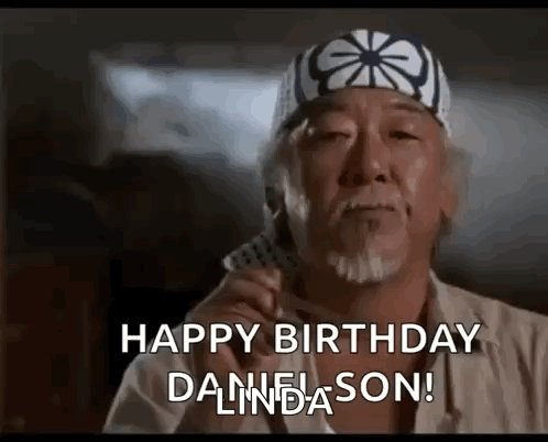 A Man Wearing A Karate Hat Is Holding A Piece Of Paper And Says `` Happy Birthday Danielson '' . GIF