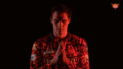 A Man Wearing A Kent Shirt With His Hands Folded GIF
