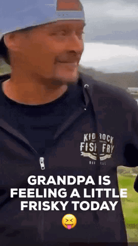 A Man Wearing A Kid Rock Fish Fry Shirt Is Making A Funny Face GIF