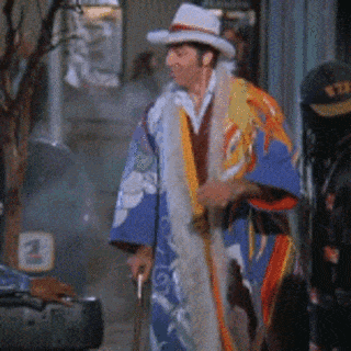 A Man Wearing A Kimono And A Hat With The Number 3 On It GIF