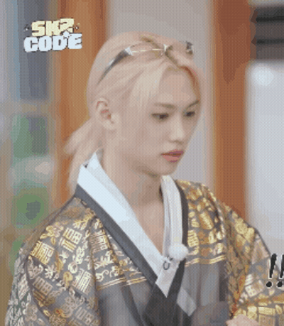A Man Wearing A Kimono And Sunglasses With The Word Ska Code On The Bottom Right GIF