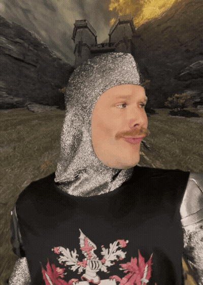 A Man Wearing A Knight 'S Helmet And Armor With A Crest On His Chest GIF