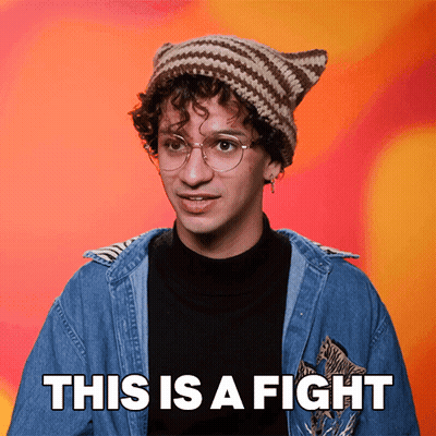 A Man Wearing A Knitted Hat And Glasses Says This Is A Fight GIF