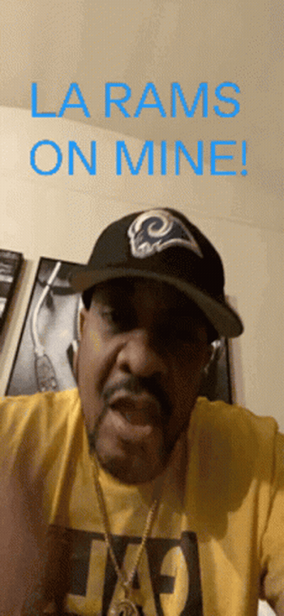 A Man Wearing A La Rams Hat And A Yellow T-Shirt Says La Rams On Mine GIF