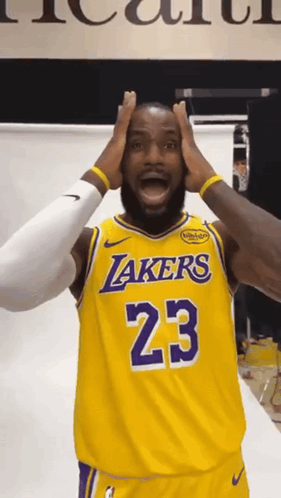 A Man Wearing A Lakers Jersey With The Number 23 GIF