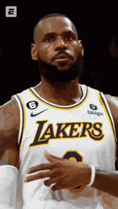 A Man Wearing A Lakers Jersey With The Number 8 On It GIF