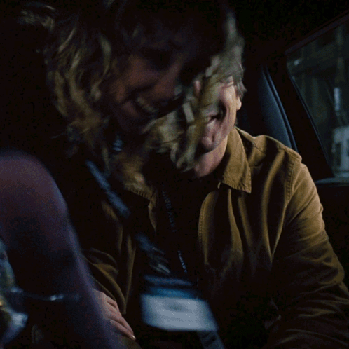 A Man Wearing A Lanyard That Says Lady Baker Smiles GIF