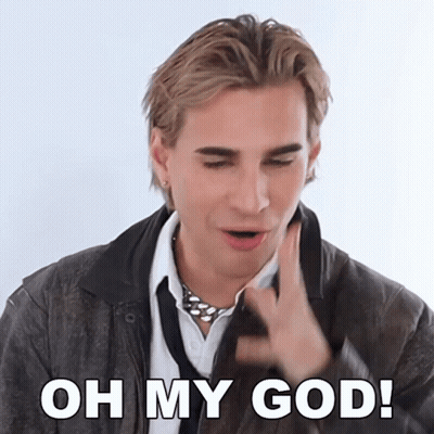 A Man Wearing A Leather Jacket And Tie Is Saying Oh My God GIF