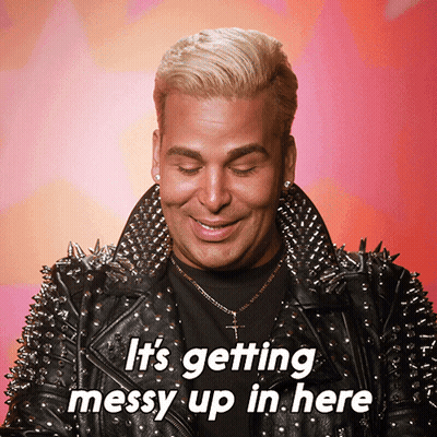 A Man Wearing A Leather Jacket With Spikes And The Words It 'S Getting Messy Up In Here Below Him GIF