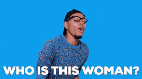A Man Wearing A Leopard Print Shirt And Glasses Is Asking Who Is This Woman . GIF