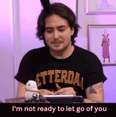 A Man Wearing A Letterda T-Shirt Is Writing On A Notepad GIF