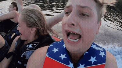 A Man Wearing A Life Vest That Says Dbx On The Front GIF