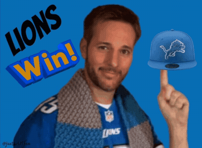 A Man Wearing A Lions Jersey Points To A Blue Hat GIF