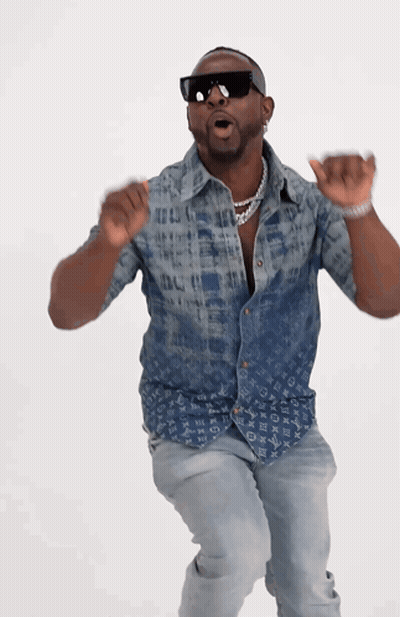 A Man Wearing A Louis Vuitton Shirt Is Dancing GIF