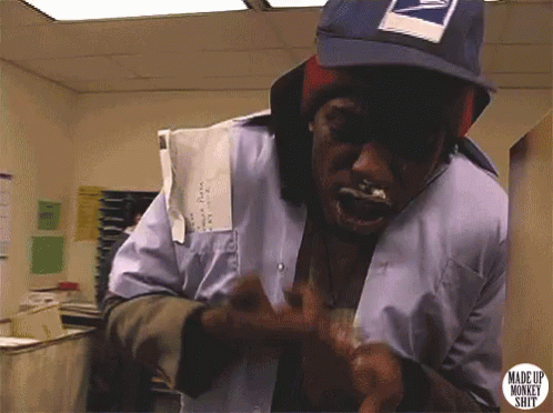 A Man Wearing A Mailman 'S Hat Has A Sticker That Says Made Up Monkey Shit On It GIF