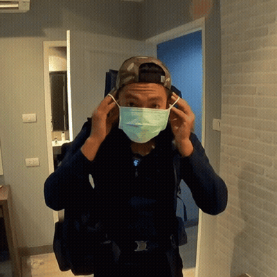 A Man Wearing A Mask And A Hat That Says Army GIF