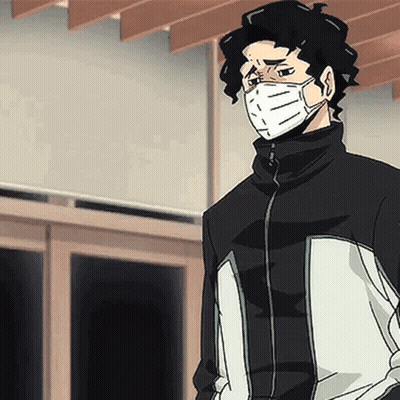 A Man Wearing A Mask And A Jacket Is Standing In Front Of A Window . GIF